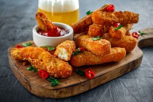 Fried Haloumi chips on a cutting board | featured image for Home.