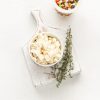 Crumbled Fetta with thyme on a serving platter. | Featured image for Fresco Cheese.
