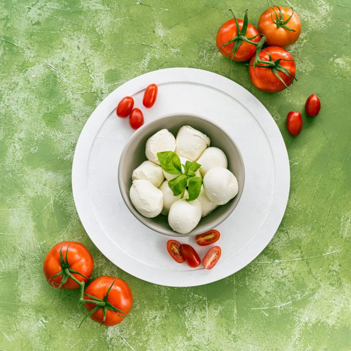 Bocconcini with basil and tomatoes. | Featured image for Fresco Cheese.