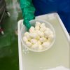 Photo of fresh cheese in a strainer | Featured image for Shop Online.